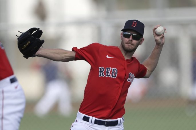 Boston Red Sox ace Chris Sale throws a baseball during spring training during camp