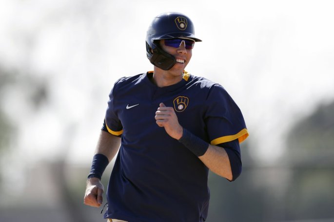 Milwaukee Brewers outfielder Christian Yelich reacts during a spring training workout